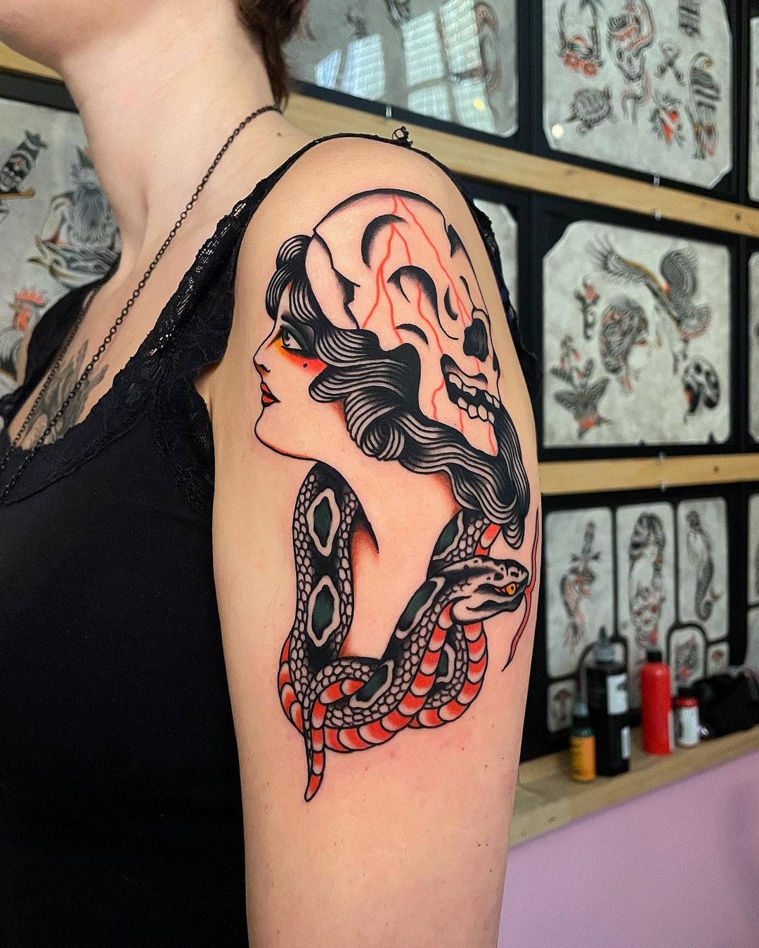 Traditional snake with girl tattoo by