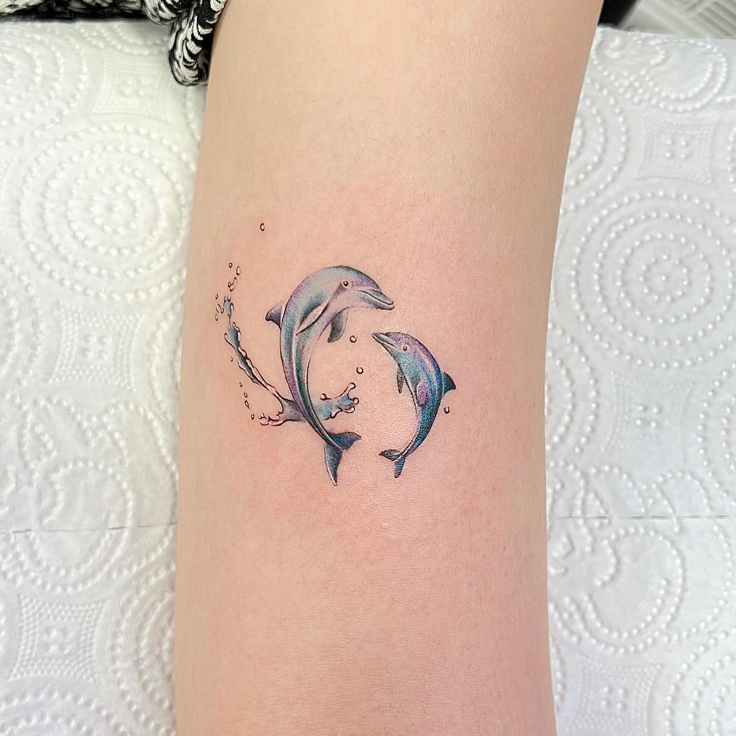 Two dolphin tattoo by tmr.tattoo