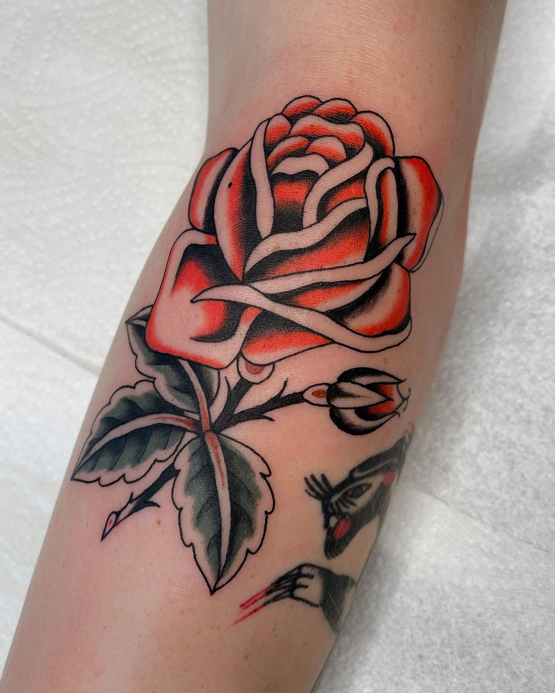 traditional rose tattoo by
