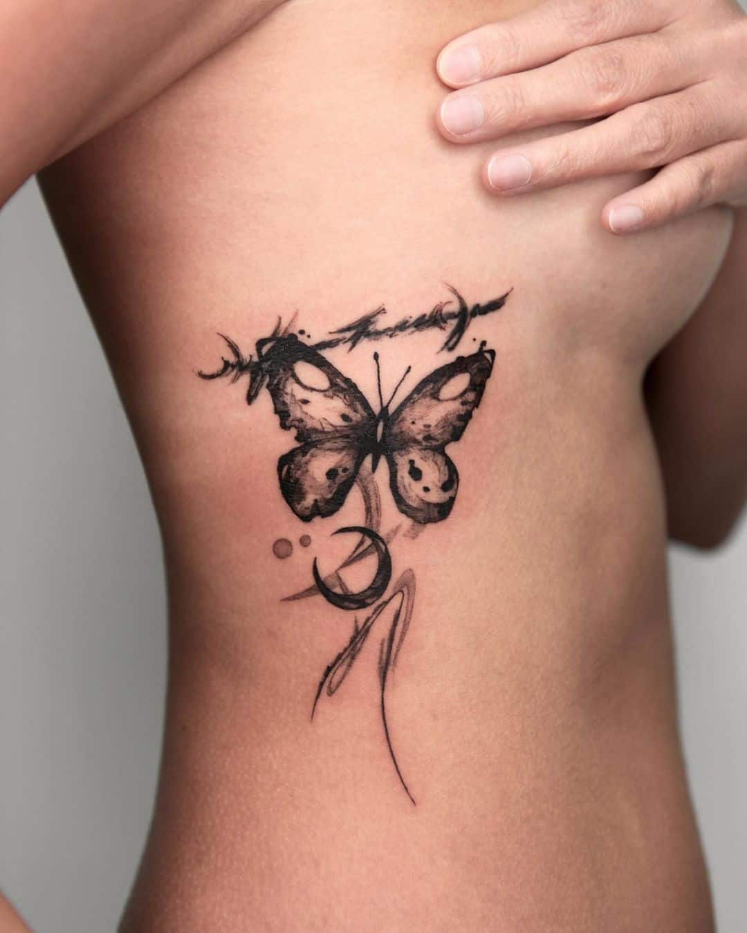 Black butterfly tattoo by moku ttt