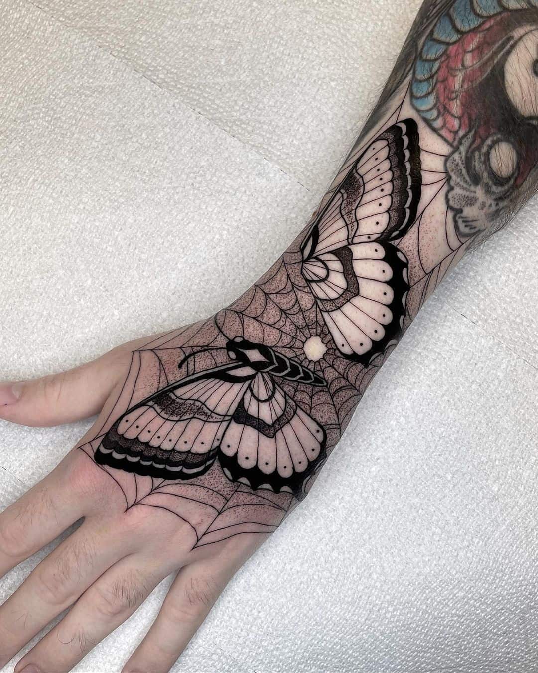 Black butterfly tattoo by robbiepina