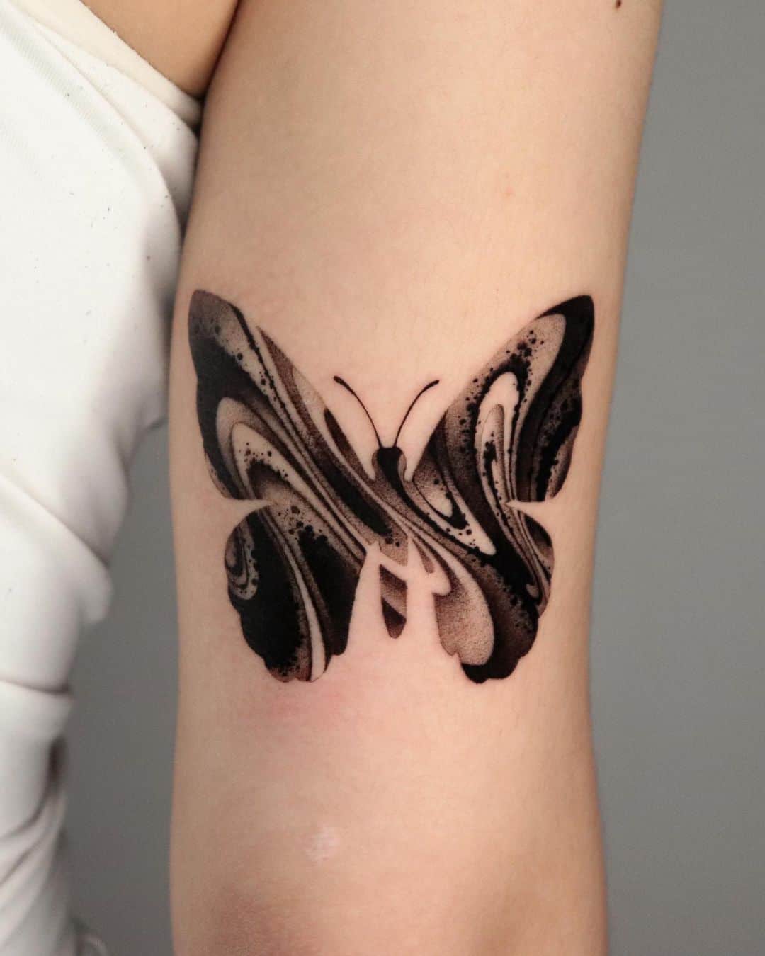 Black butterfly tattoo by wekid impastotattoo
