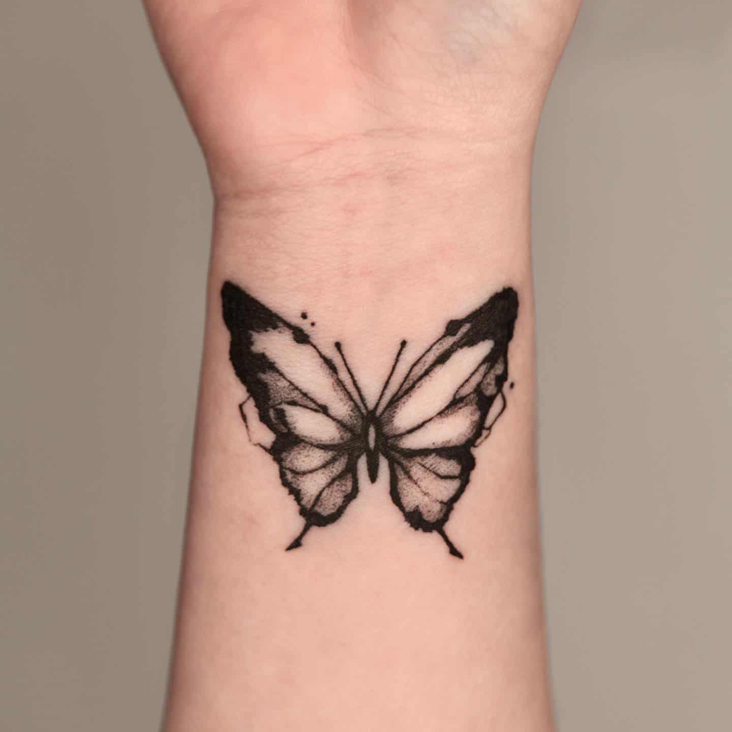Blck butterfly tattoo by moku ttt