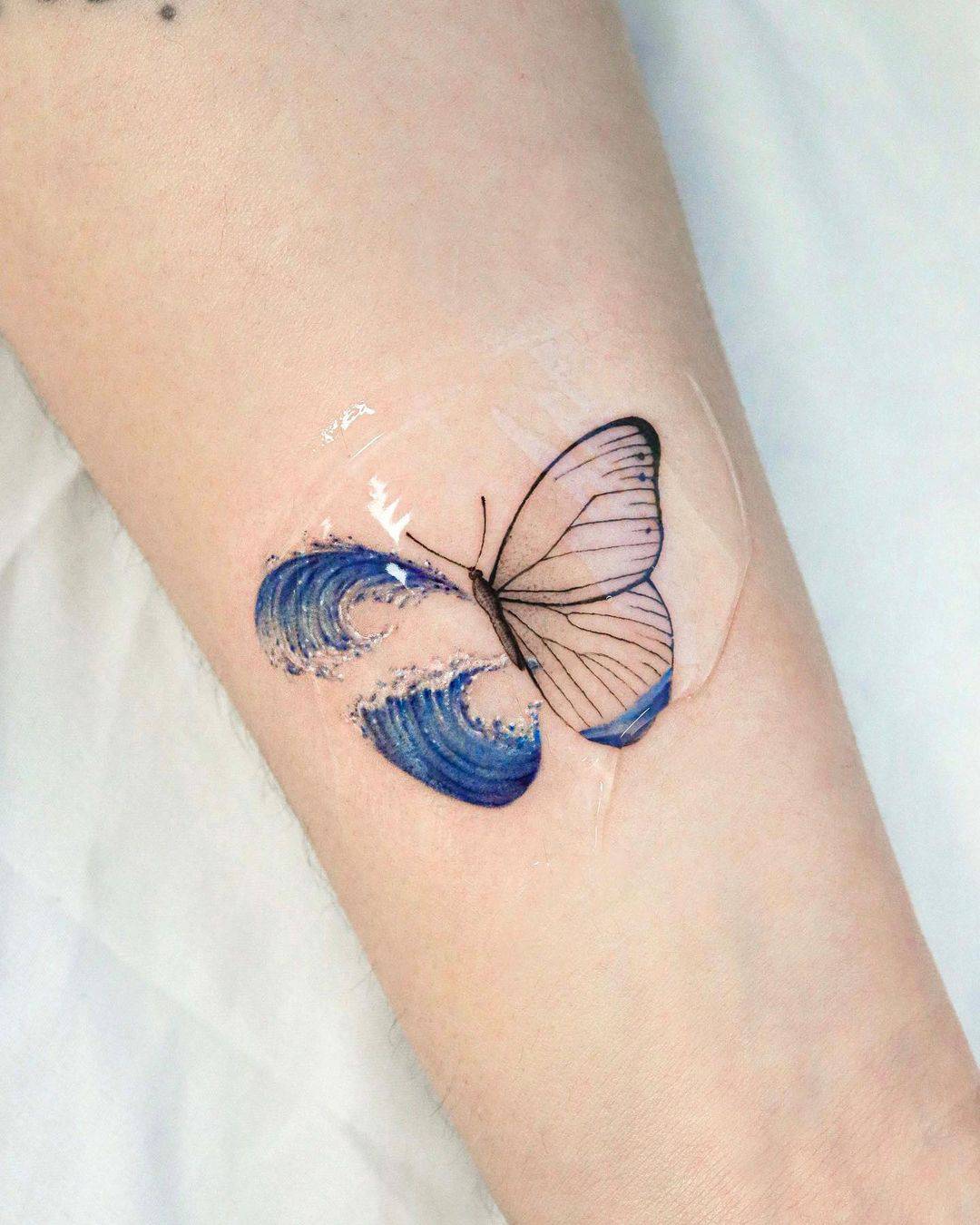 Blue butterfly tattoo by mooji tt