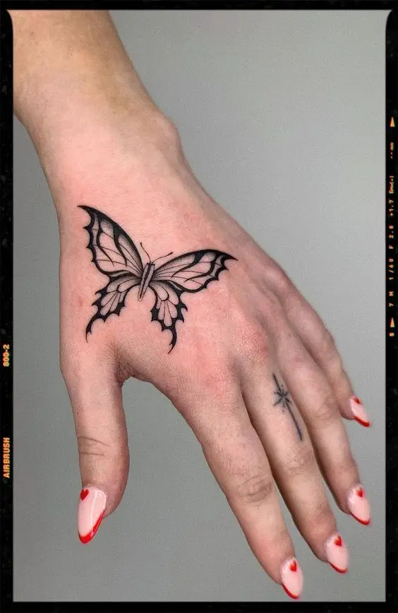 Butterfly hand tattoo 1