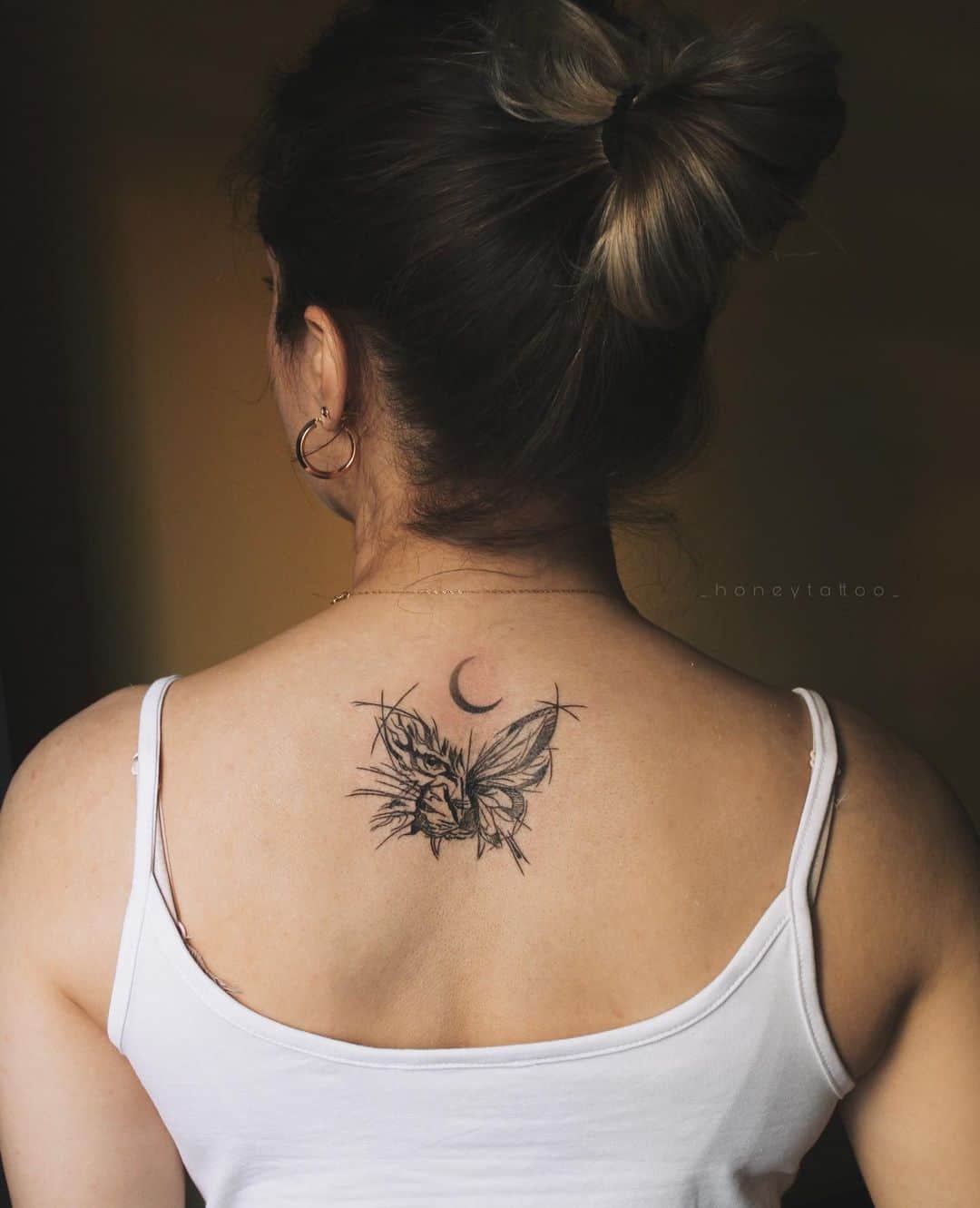Butterfly on back tattoo by honeytattoo