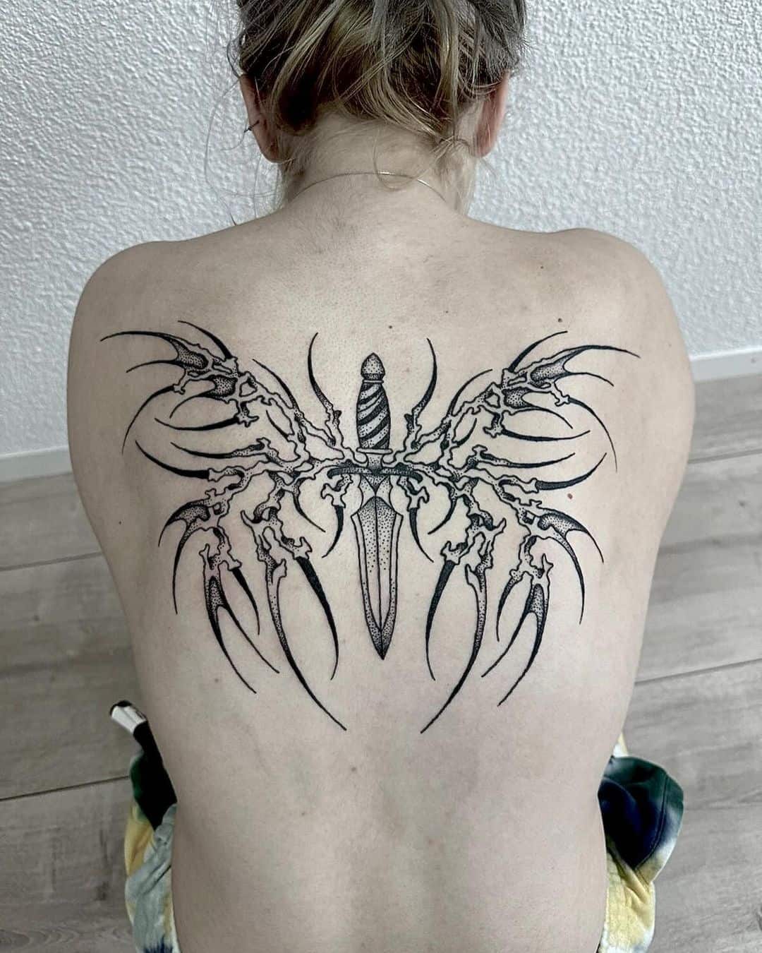 Butterfly on back tattoo by anunnaki art