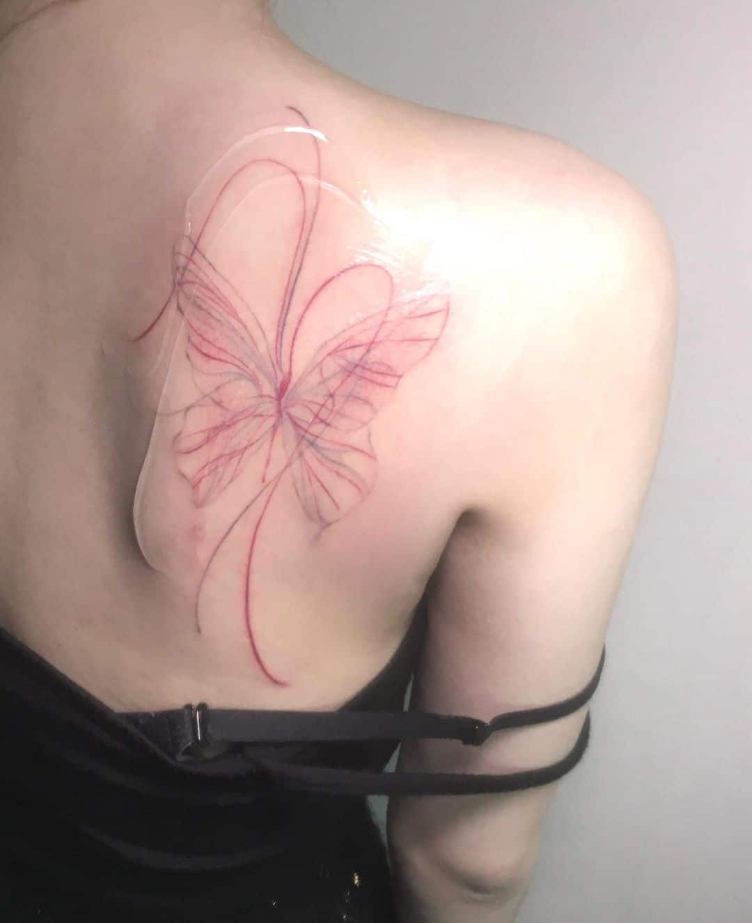 Butterfly on back tattoo by tt.wana