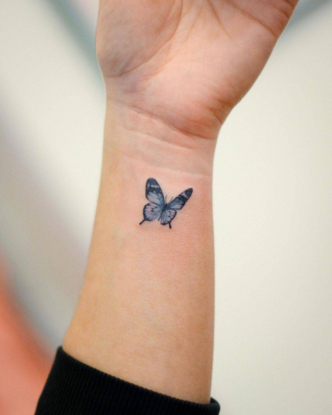 Butterfly on wrist tattoo by tattooist jason