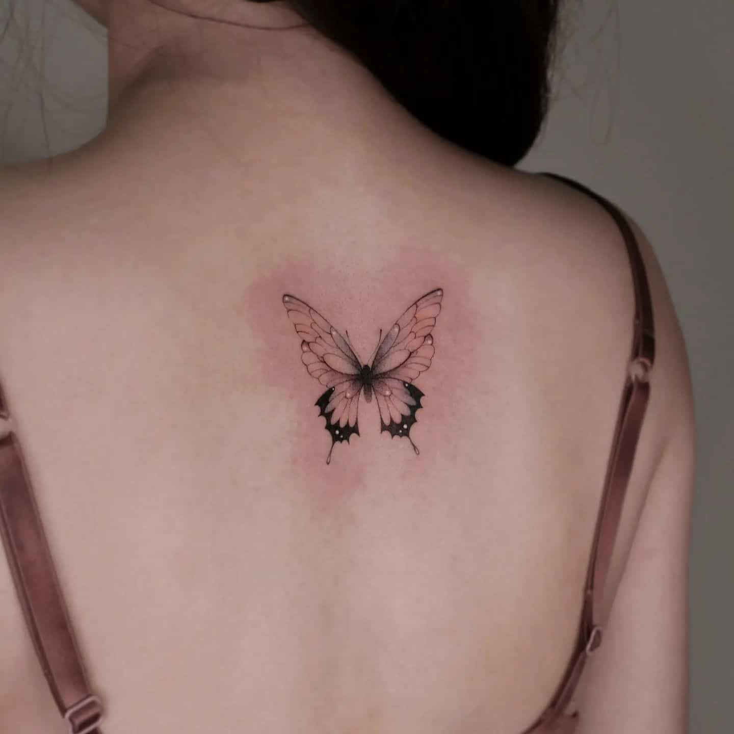 Butterfly tattoo on back by saku.tatt