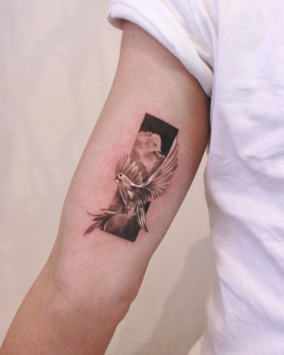 Minimalistic dove tattoo by jku tattoo