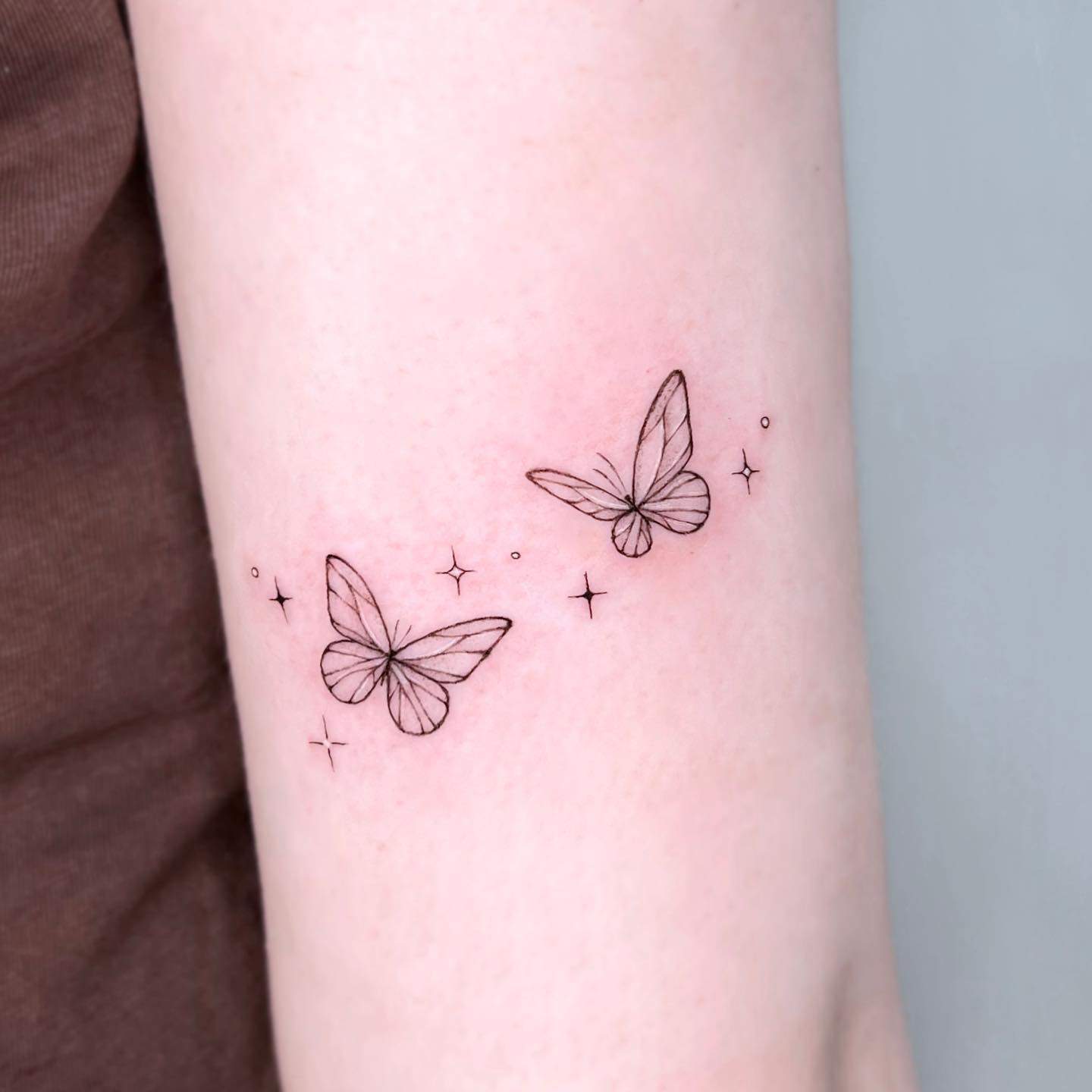 Small butterfly tattoo by da.an tattooer