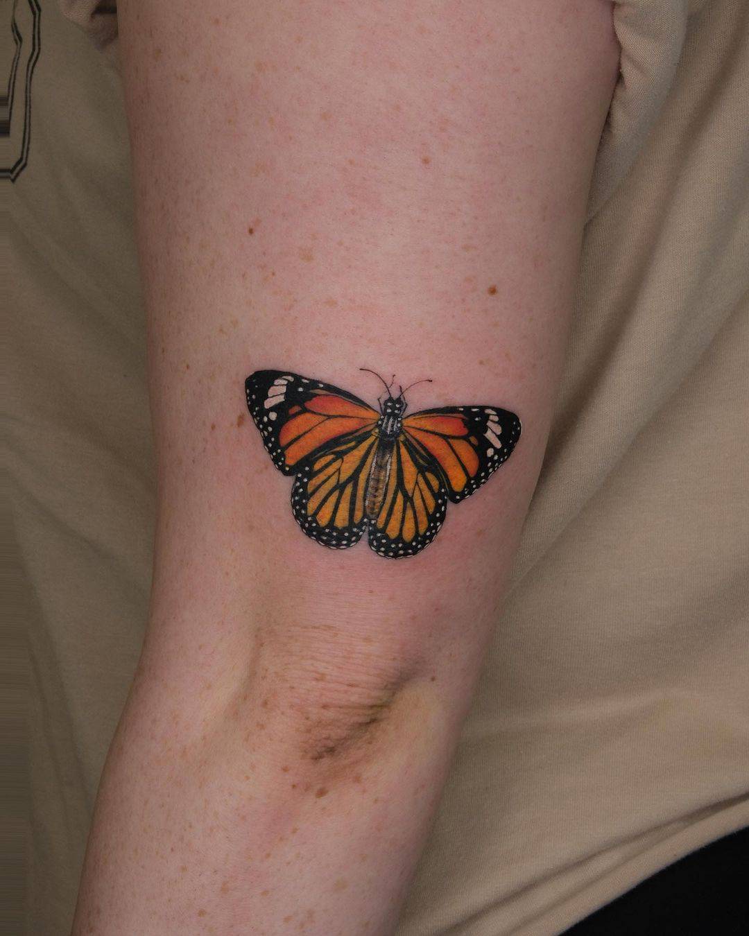 Small butterfly tattoo by vivi tattooer