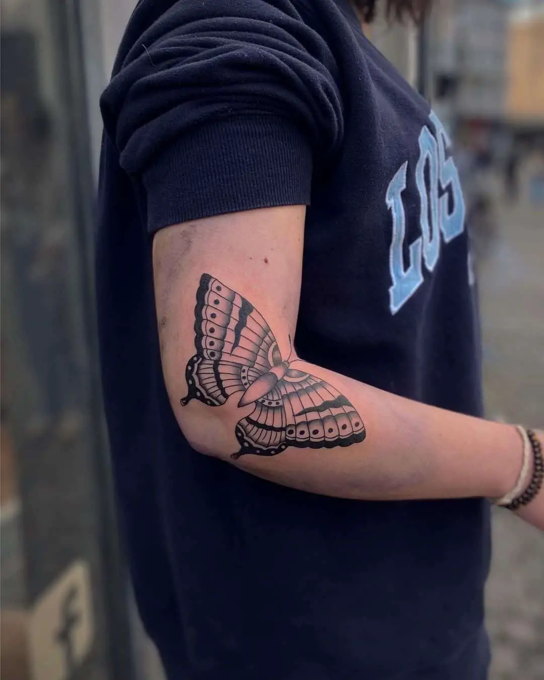 Traditional butterfly tattoo by abulia.tattoo