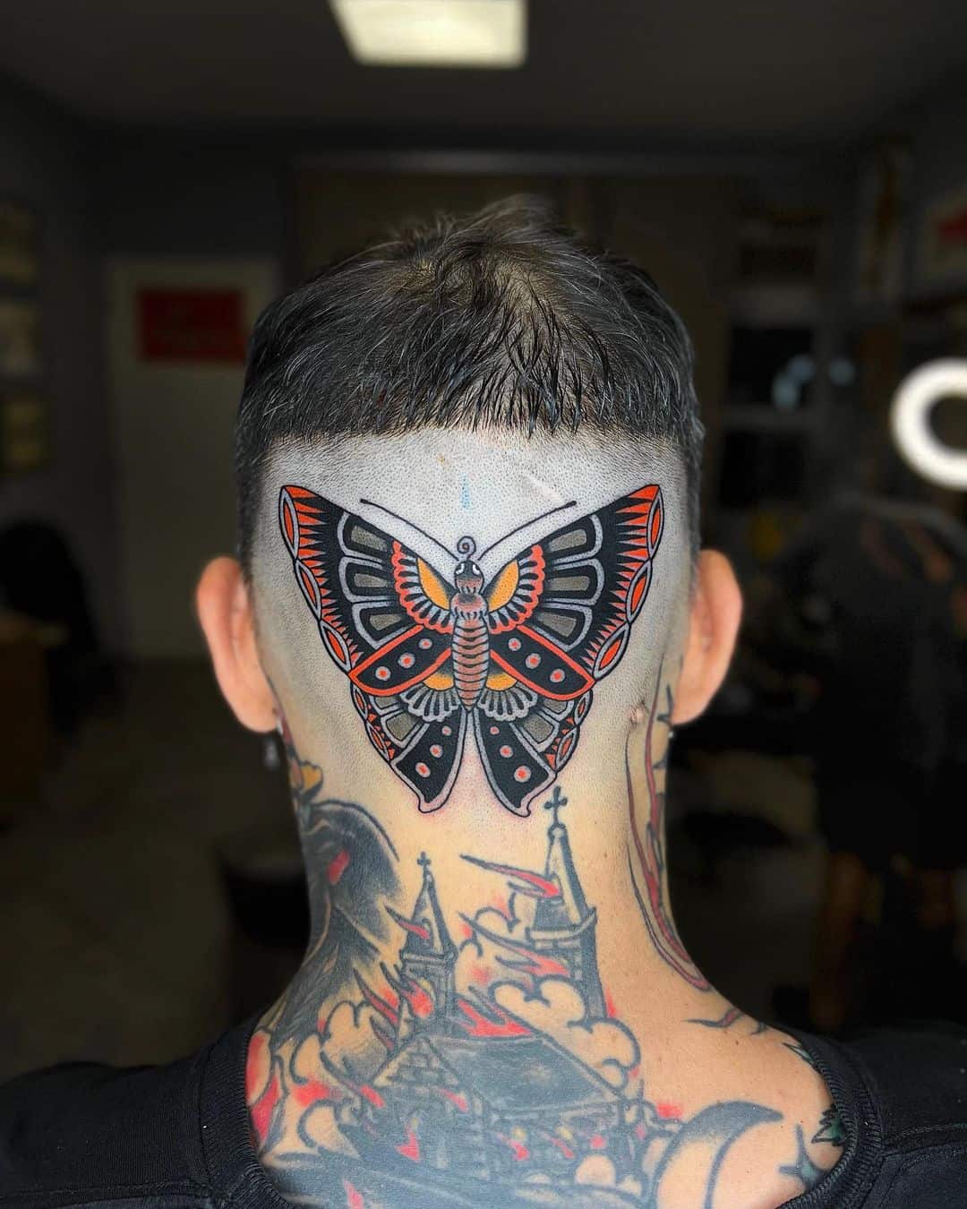 Traditional butterfly tattoo by