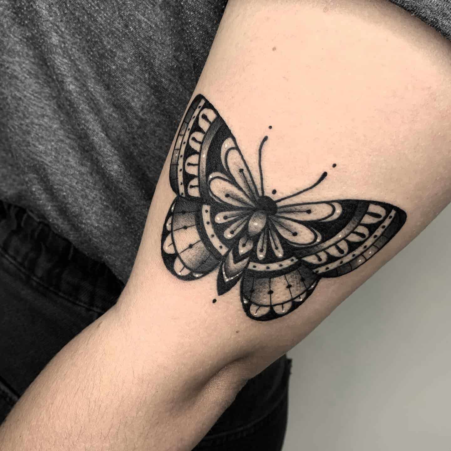 Traditional butterfly tattoo by ginatp tattoo