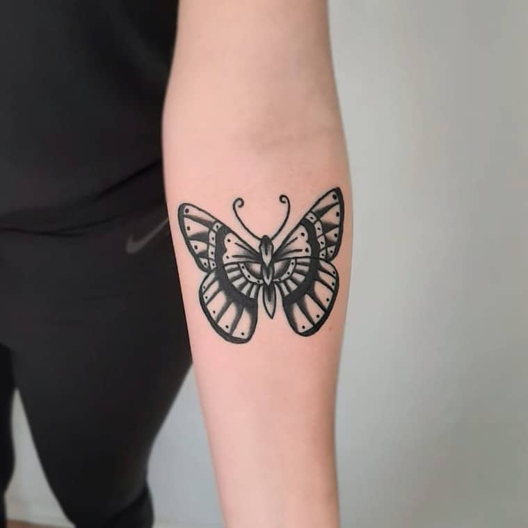 Traditional butterfly tattoo by marcelom.ink
