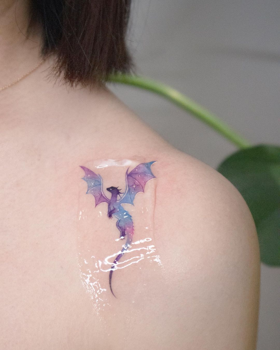 Watercolor dragon tattoo for women by siren ink