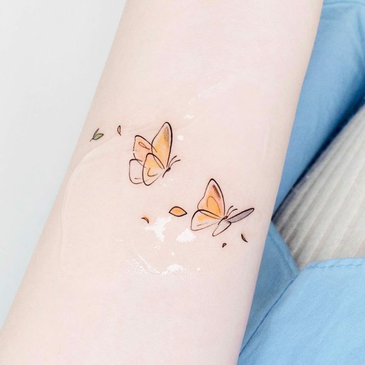 Yellow butterfly tattoo 1