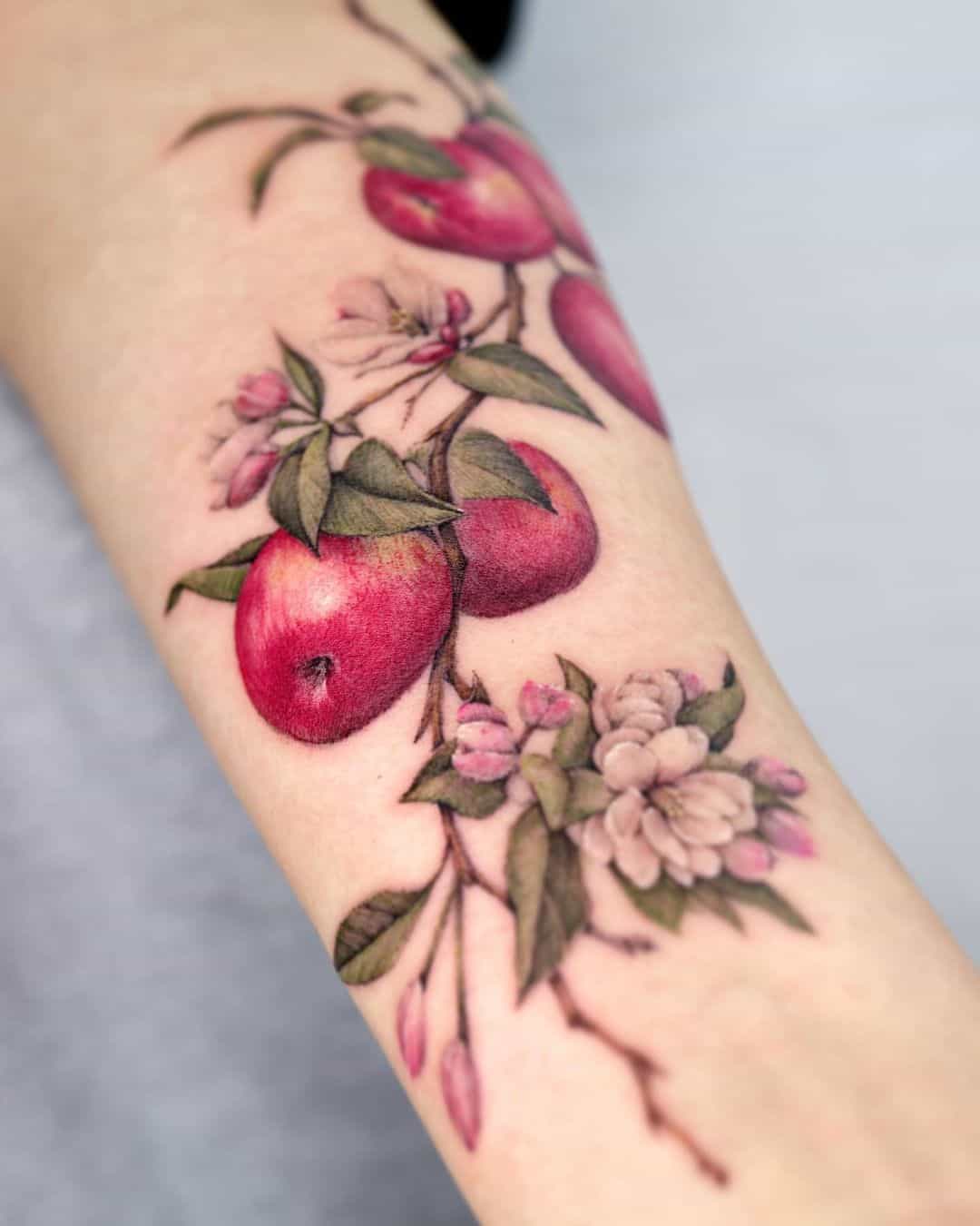 Apple tattoo by tattooist color.b