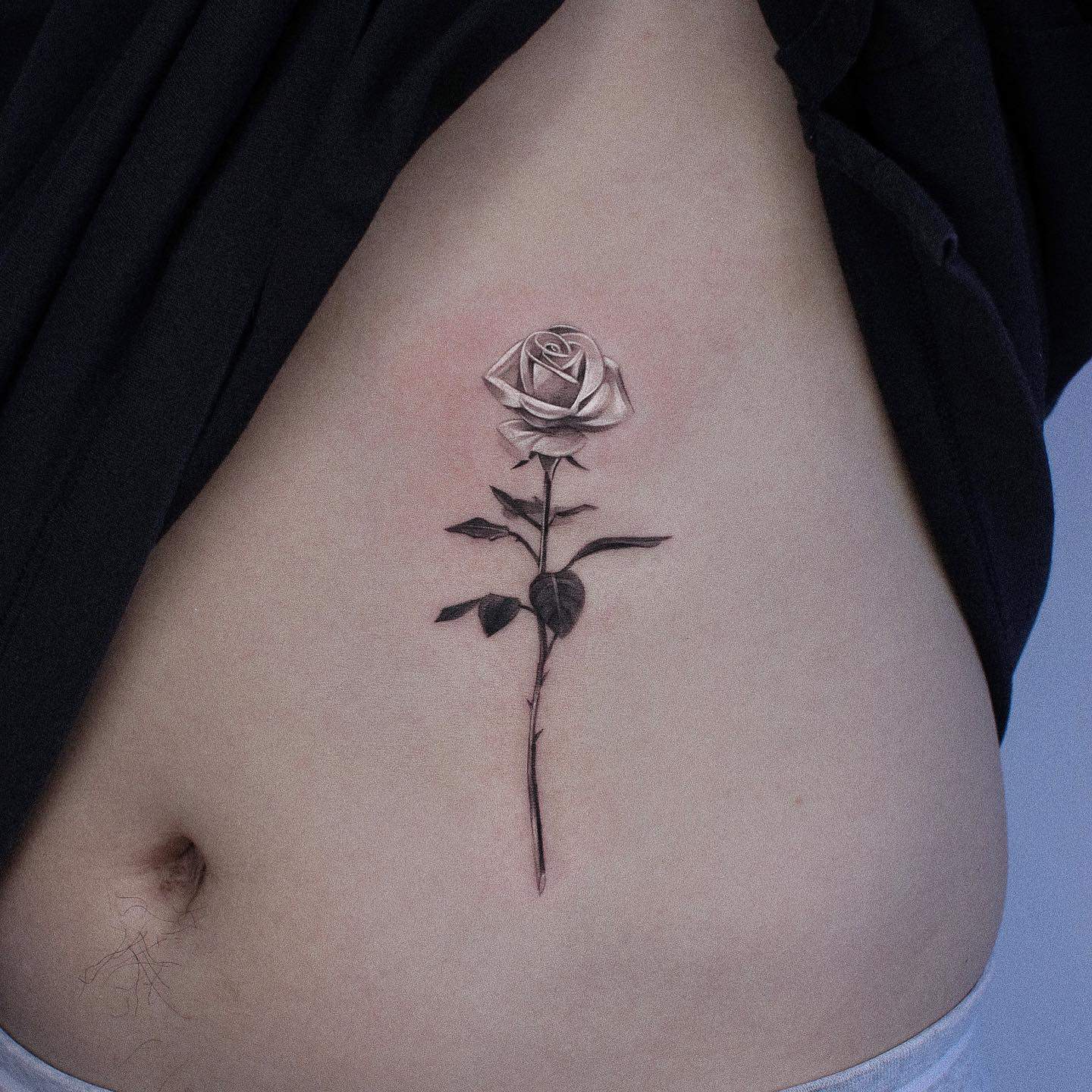 Black and grey rose tattoo by jku tattoo