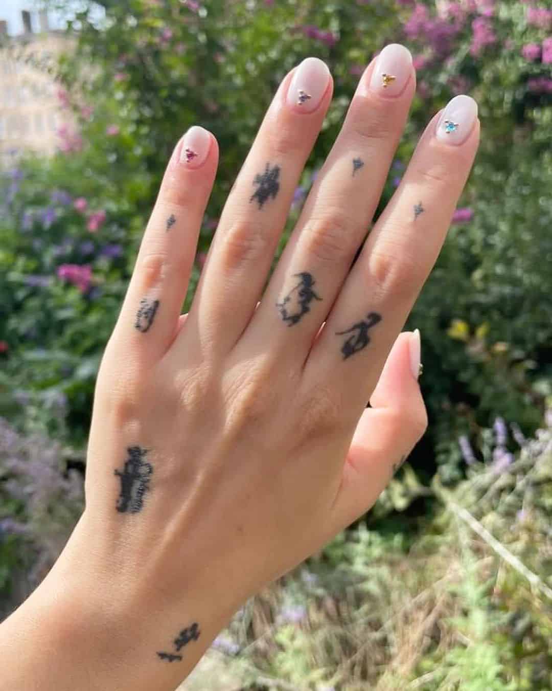 Black ink finger tattoo by ghislain