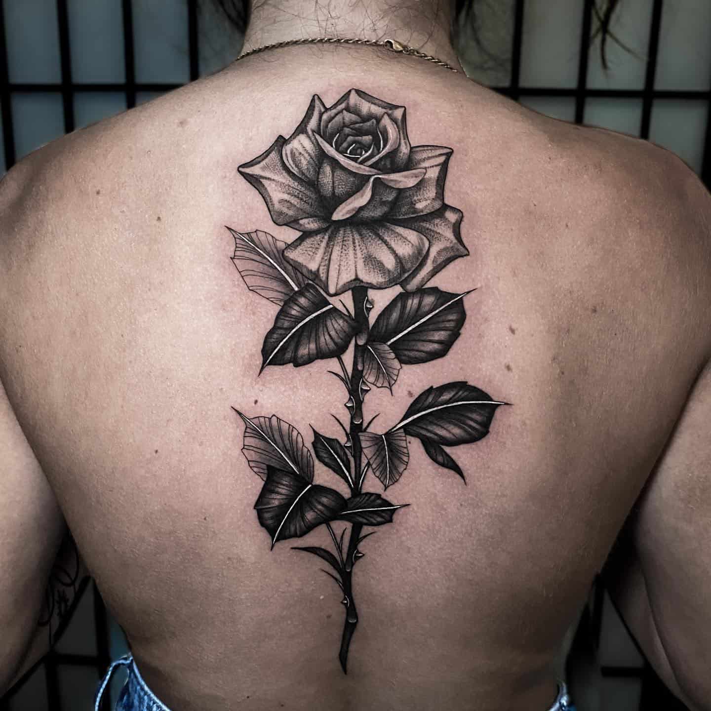Black rose tattoo by zebra ink