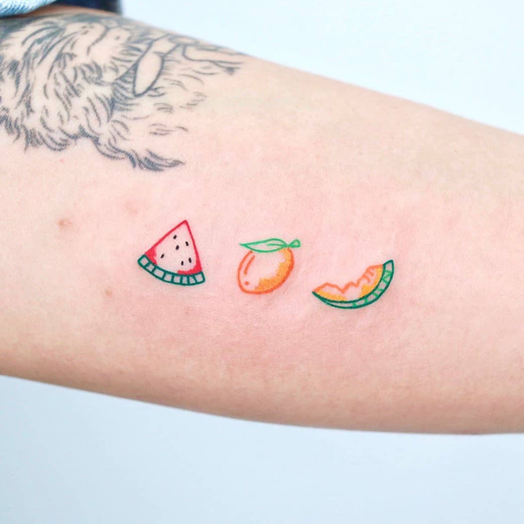 Colorful fruit tattoo by soy tattoo