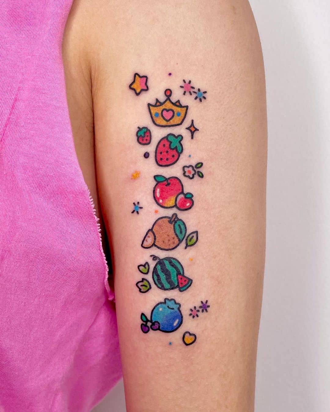 Colorful fruit tattoo by