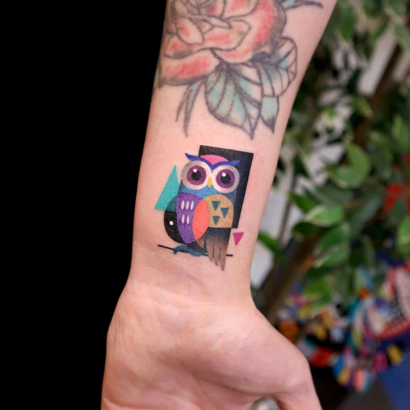 Colorful owl tattoo by rolypolyc