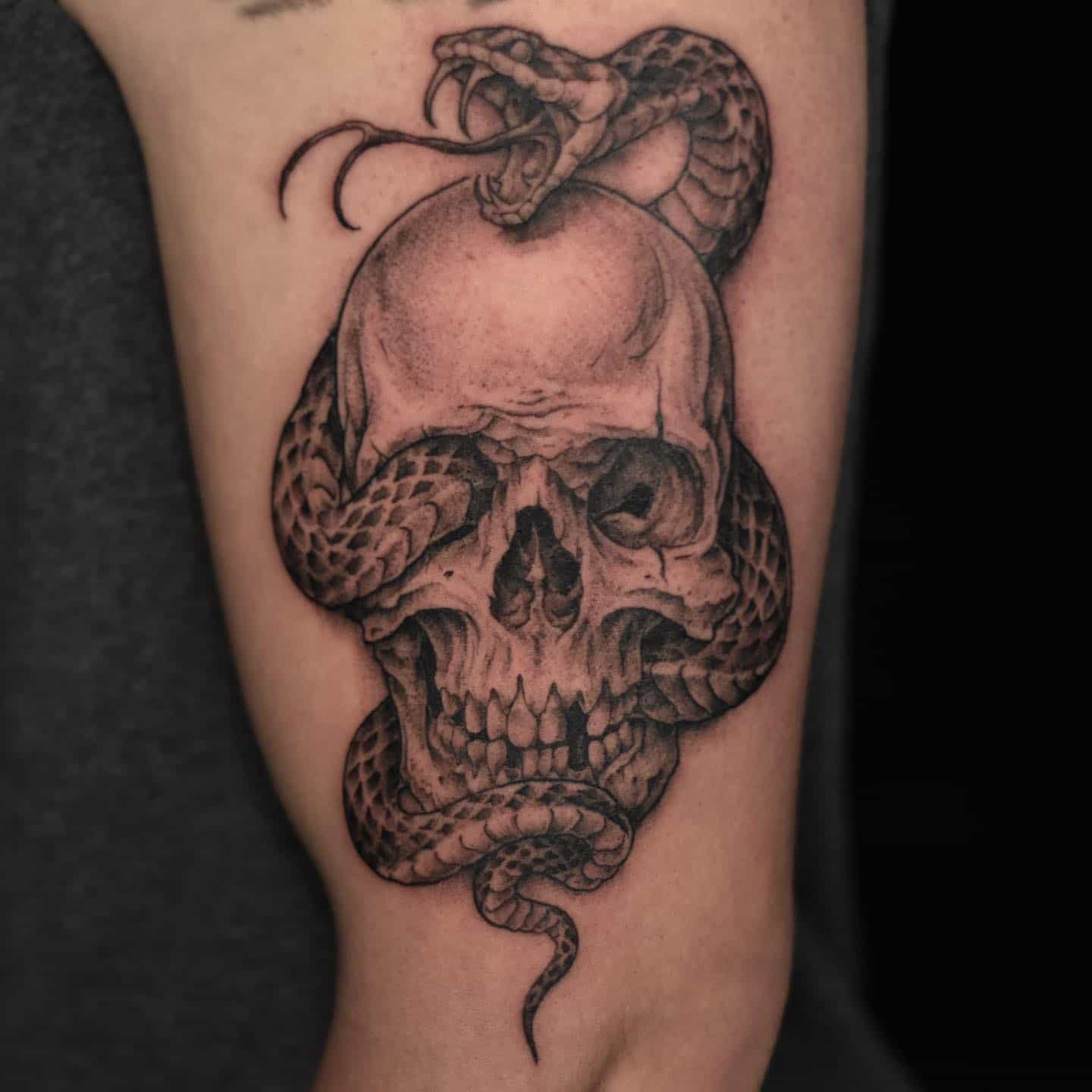 Dot skull tattoo by dan logan tattoo