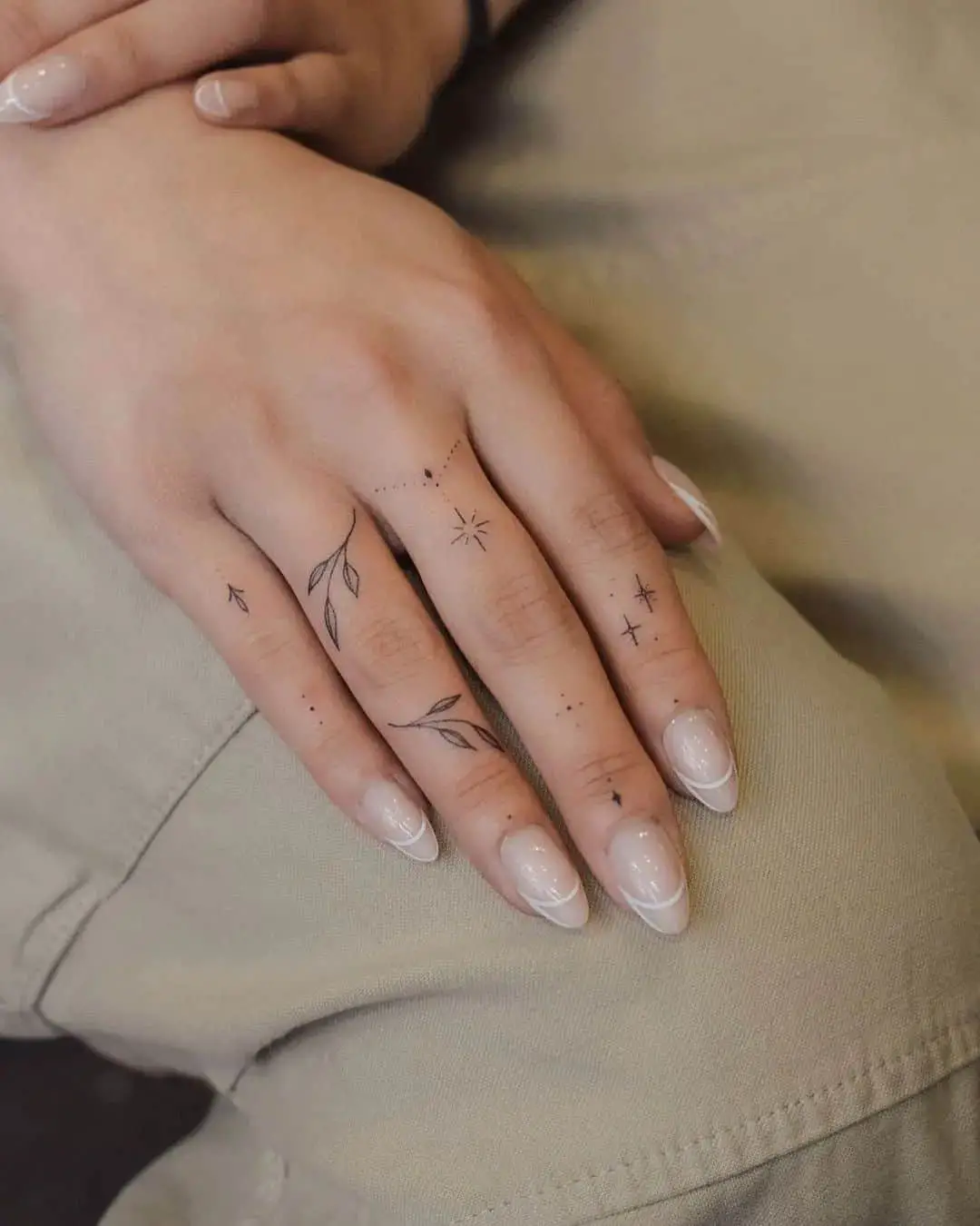 Finger tattoo for women by tiny.tatts