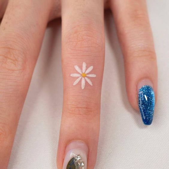 Flower tattoo on finger 1