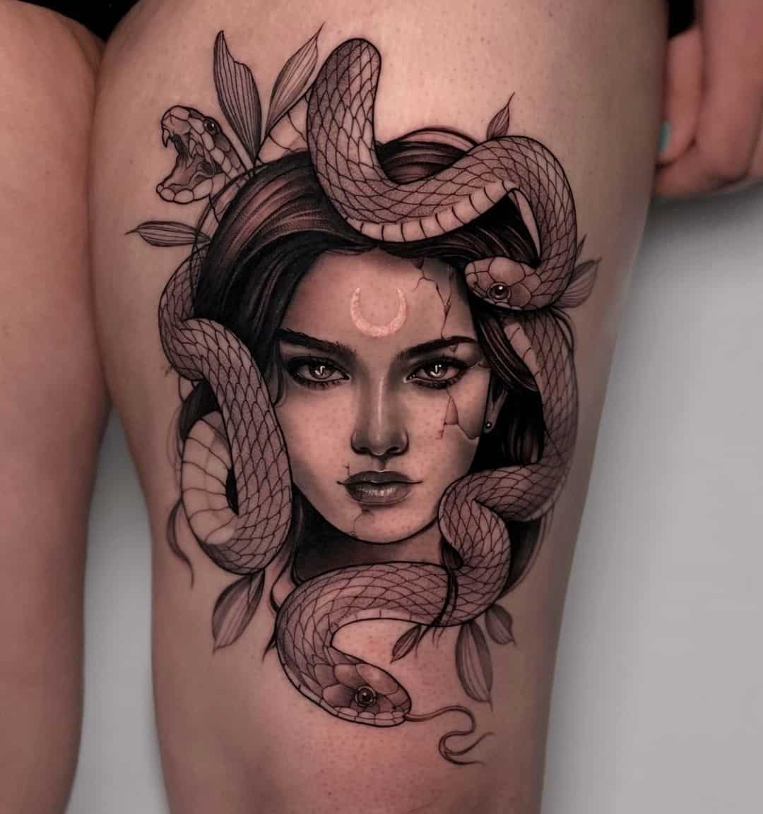 Medusa tattoo on thigh by victoria.tattoos
