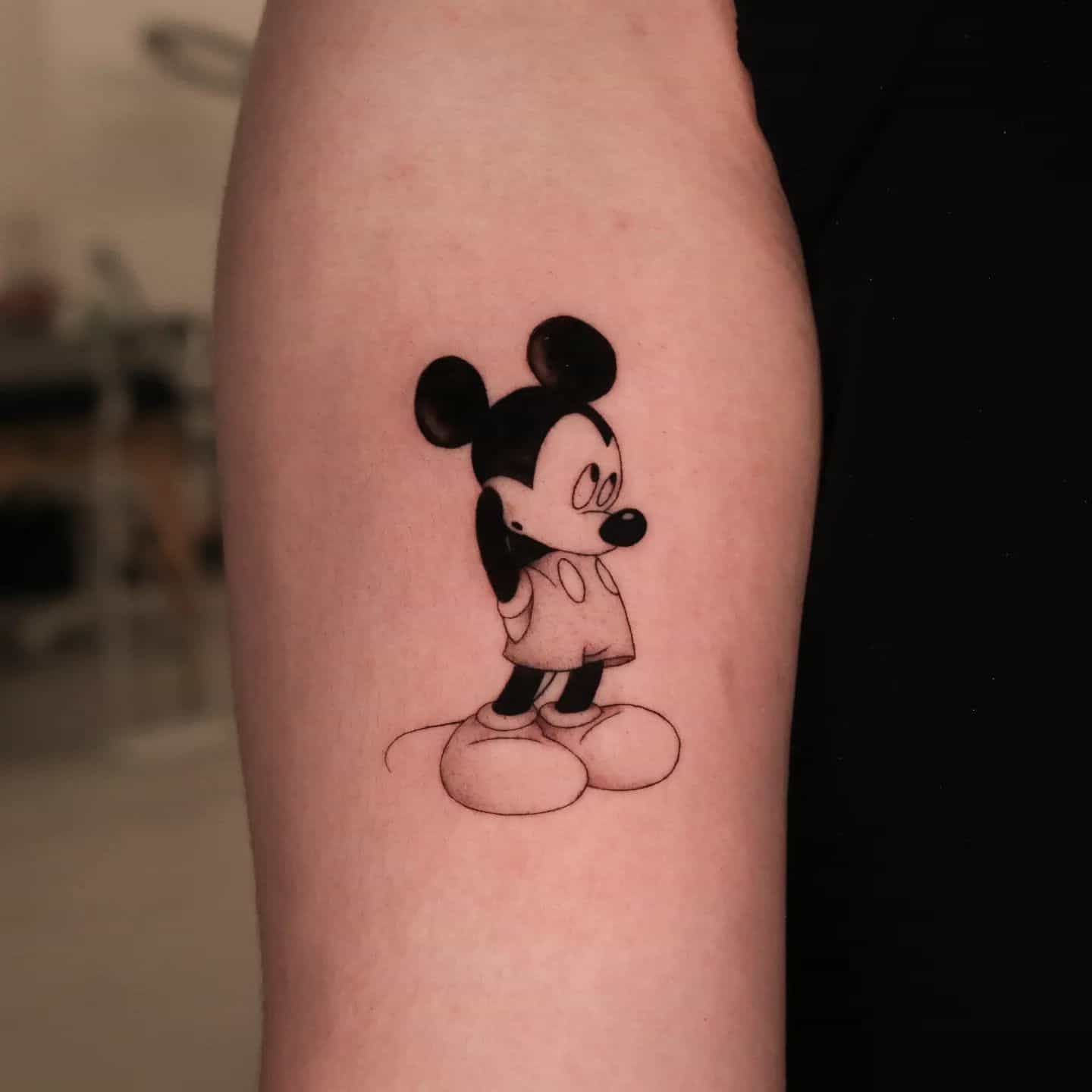 Mickey mouse tattoo by nickey tattooer