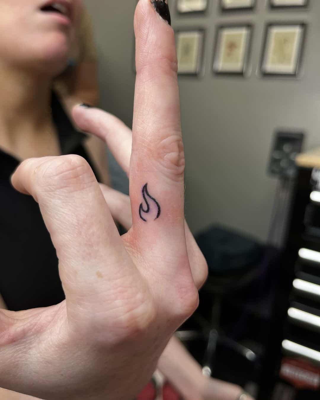 Middle finger tattoo by tythetattooer
