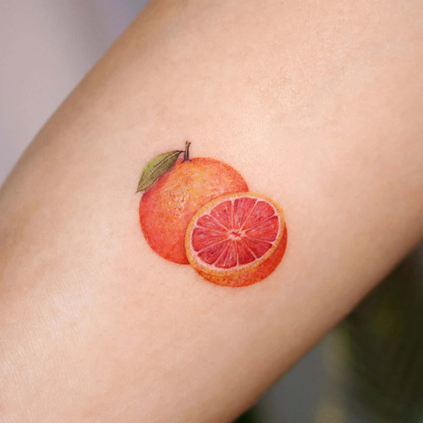 Orange tattoo by tattooist namoo
