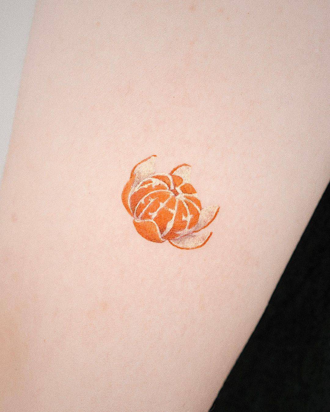 Orange tattoo by youngchickentattoo