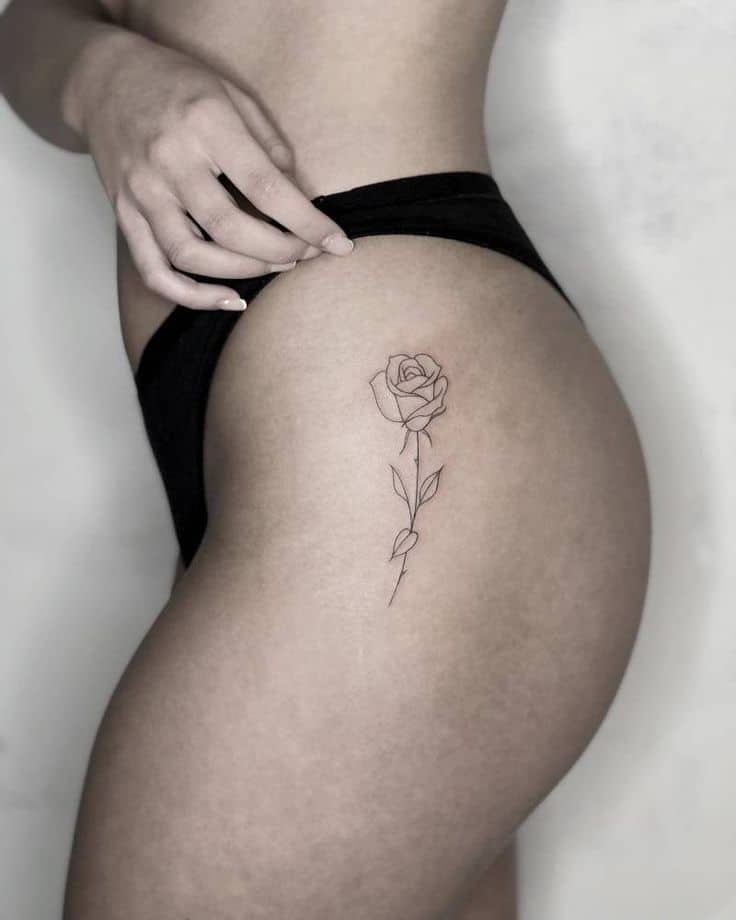 Rose tattoo on thigh 1