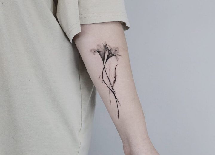 Single flower tattoo by
