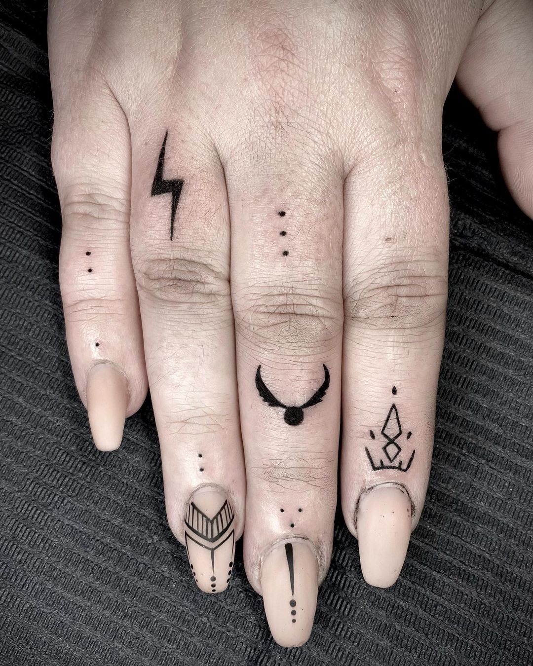 Unique finger tattoo by witch of the north tattoos