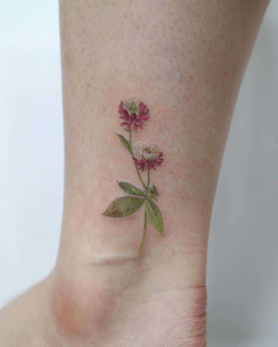 ankle tattoos by rhamone tattoo