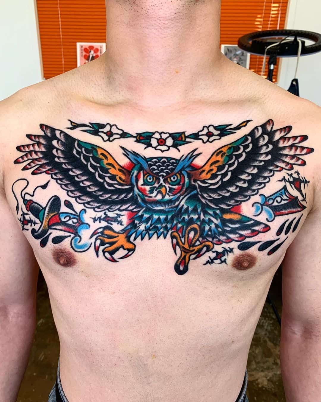 owl tattoo on chest by junzy.tattooer