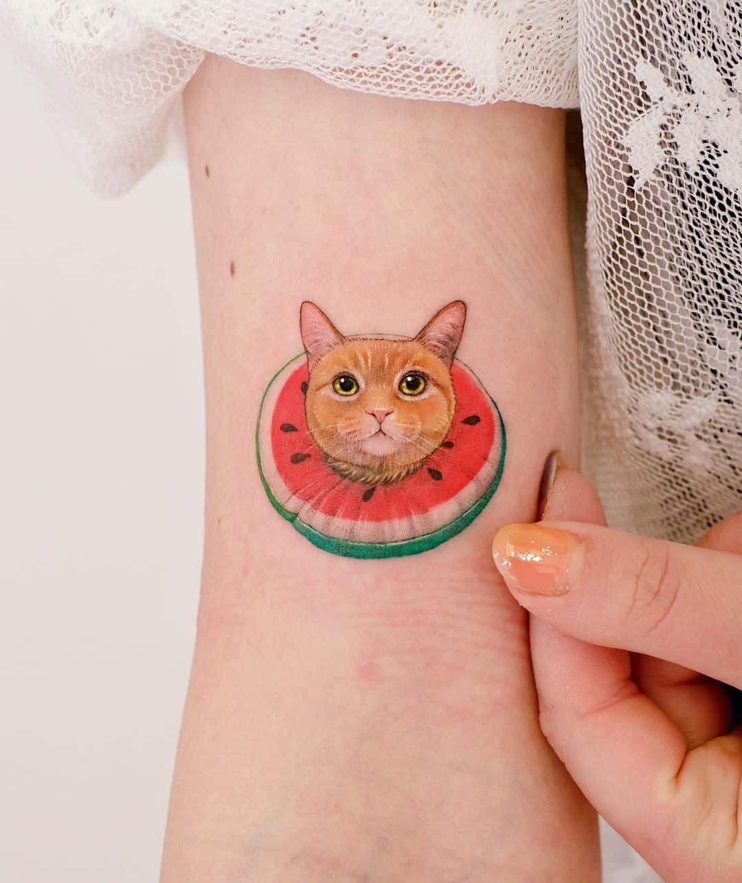 Cat and watermelon tattoo by paw.tattoo