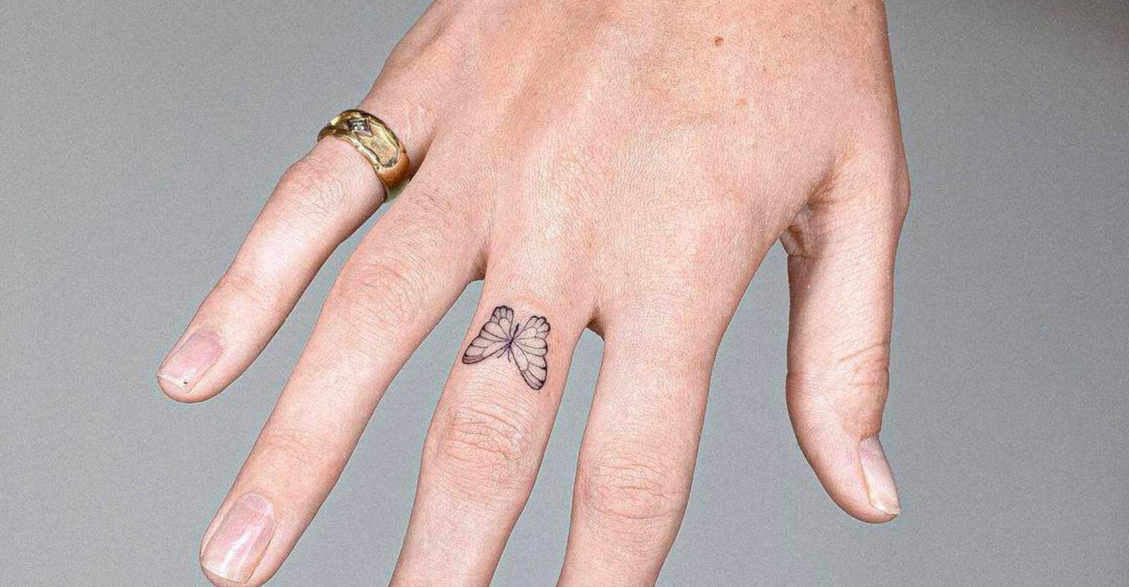 hands and fingers tattoos - the black hat tattoo