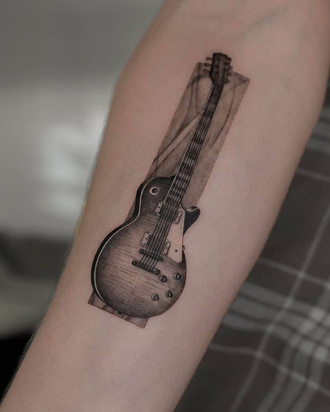 Guitar tattoo by binofeyer