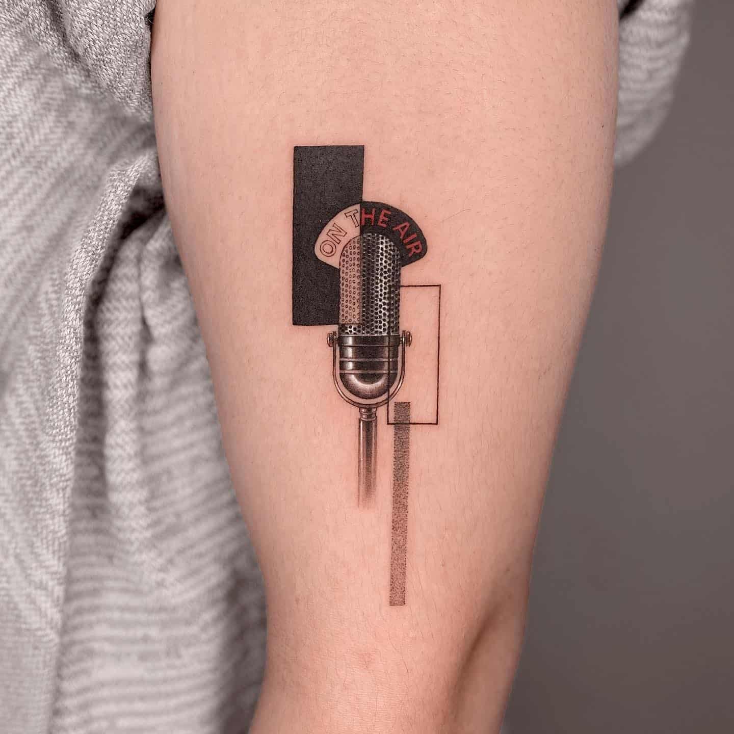 Microphone tattoo by graycodetattoo