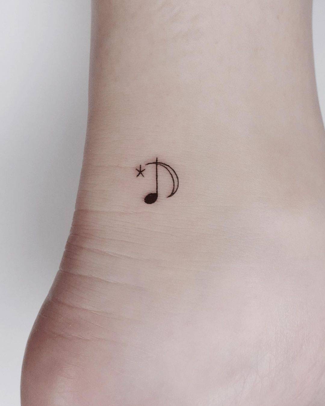 Music note tattoo by nieun tat2