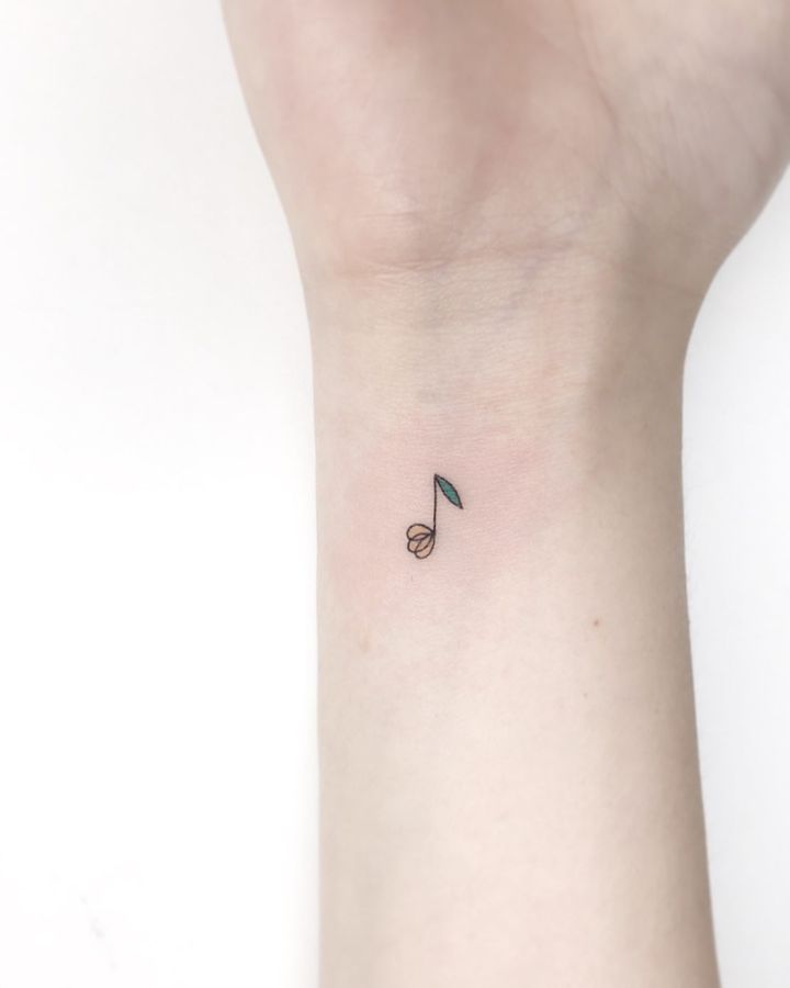 Music tattoo on wrist by nieun tat2