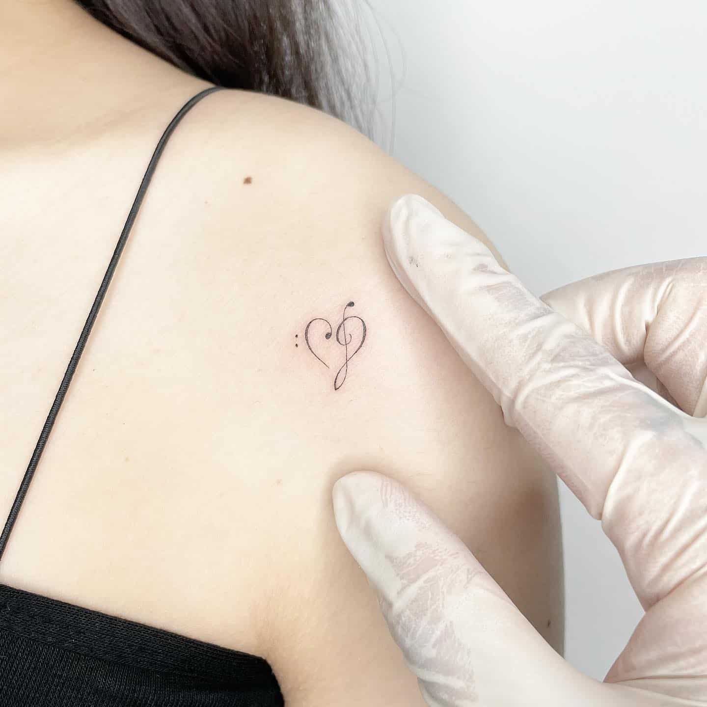 Music with heart tattoo by sop tattoo